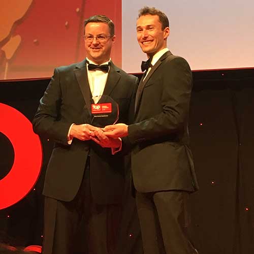 Nathan Coburn (left), HR director at BSH Home Appliances, collecting the award